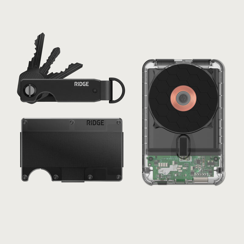Ridge Wallet + Power Bank + KeyCase - Phantom: black wallet, black KeyCase with keys, and clear-back power bank side by side.
