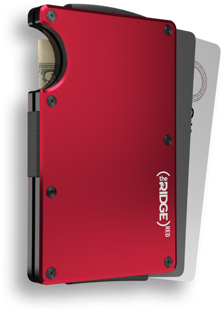 A red aluminum Ridge Wallet vertically oriented with some cash peeking out from the left side and two cards peeking out from the right